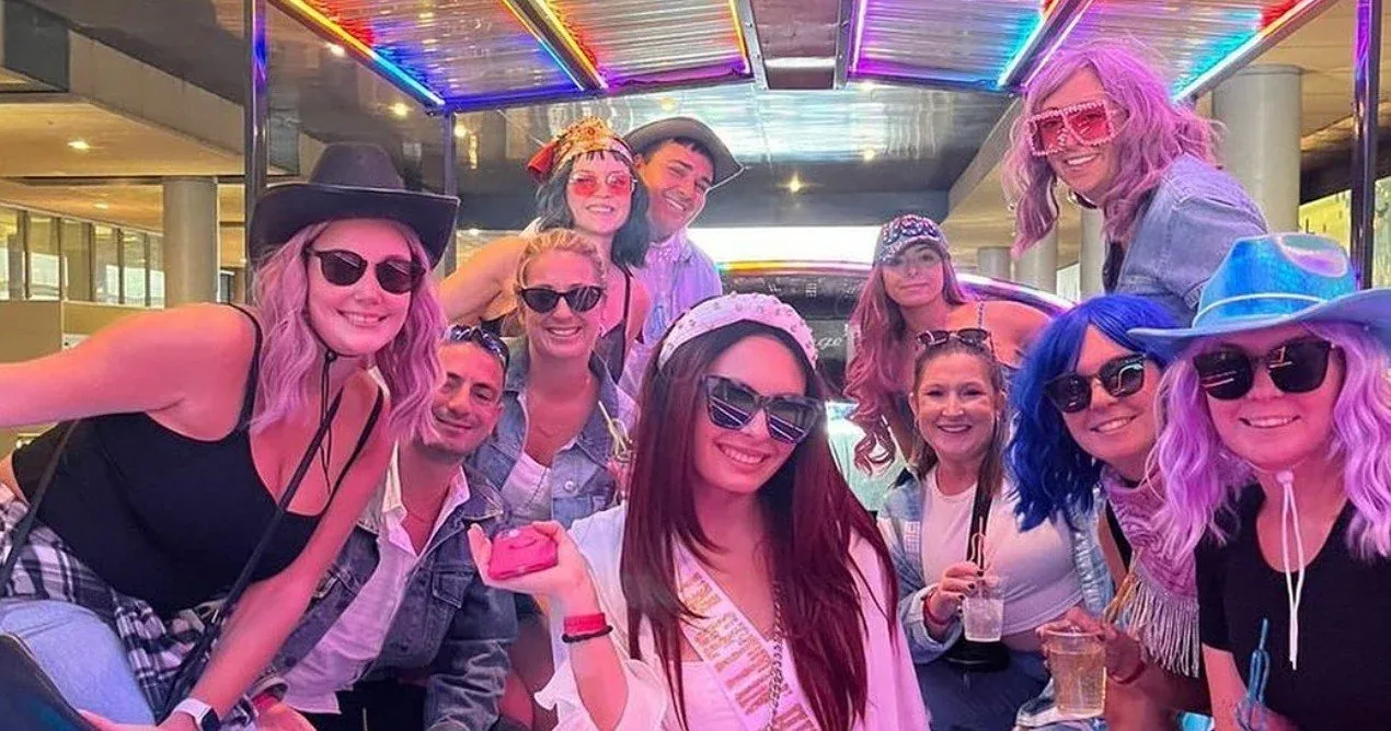 A bachelorette party celebrating together in a Nashville honky-tonk