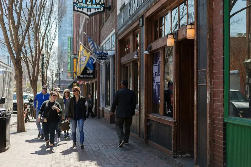 A team walking Lower Broadway on an A Little Local Flavor tour