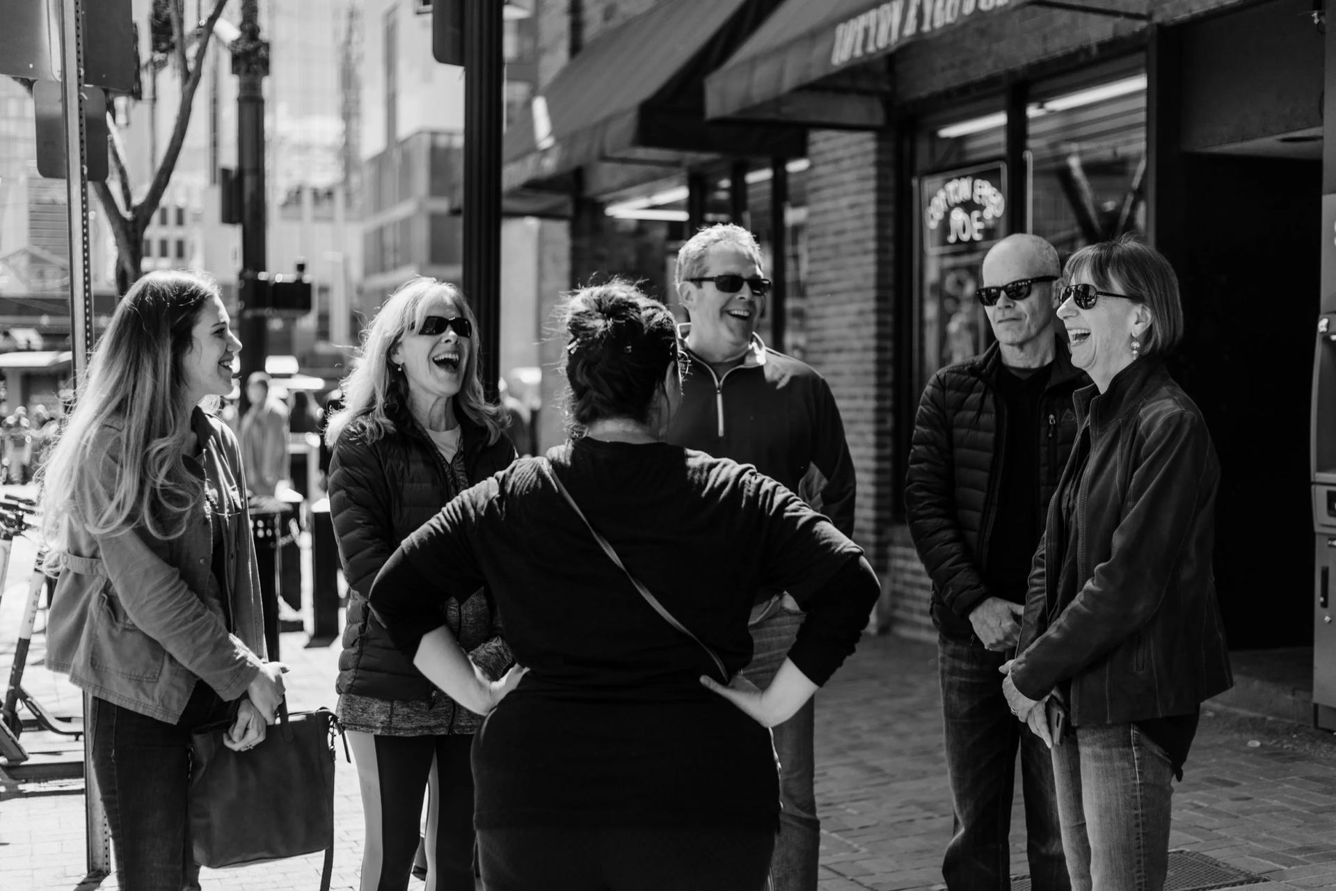 An A Little Local Flavor guide laughing with a tour group in downtown Nashville
